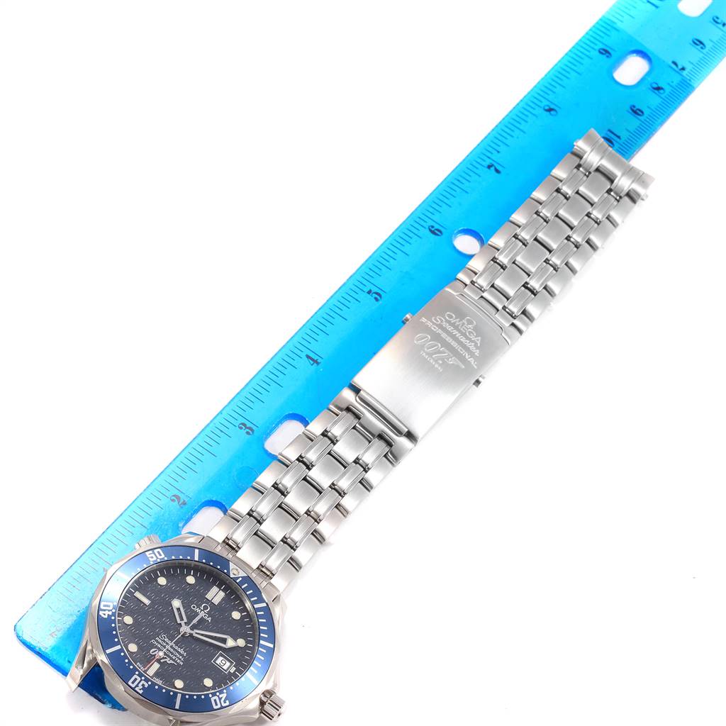 This image shows a top view of an Omega Seamaster 2537.80.00 Men
s Stainless Steel Blue Dial 2537.80.00 Men
s Stainless Steel Blue Dial watch, displaying its bracelet, clasp, and face alongside a ruler for scale.