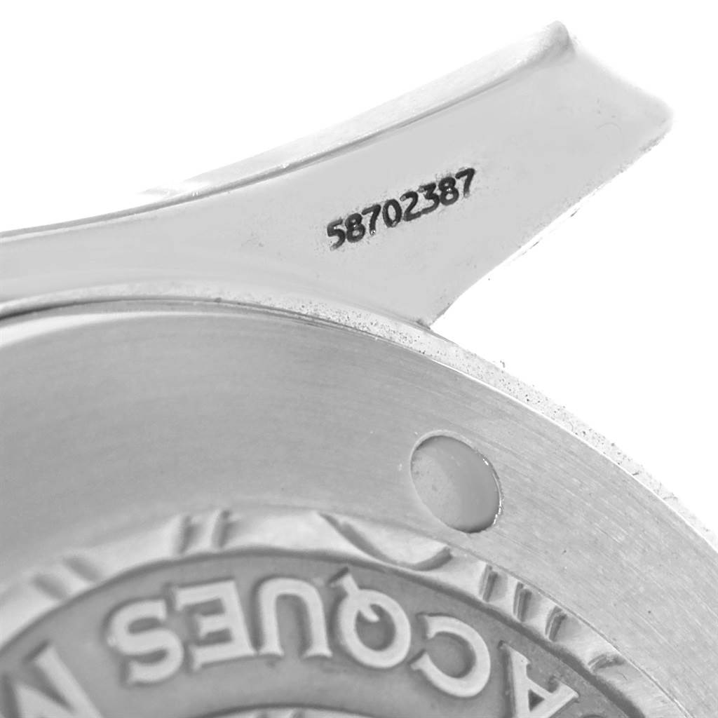 The image shows a close-up angle of the Omega Seamaster 2595.50.00 Men
s Stainless Steel Black Dial 2595.50.00 Men
s Stainless Steel Black Dial model
s case back, focusing on the serial number area.