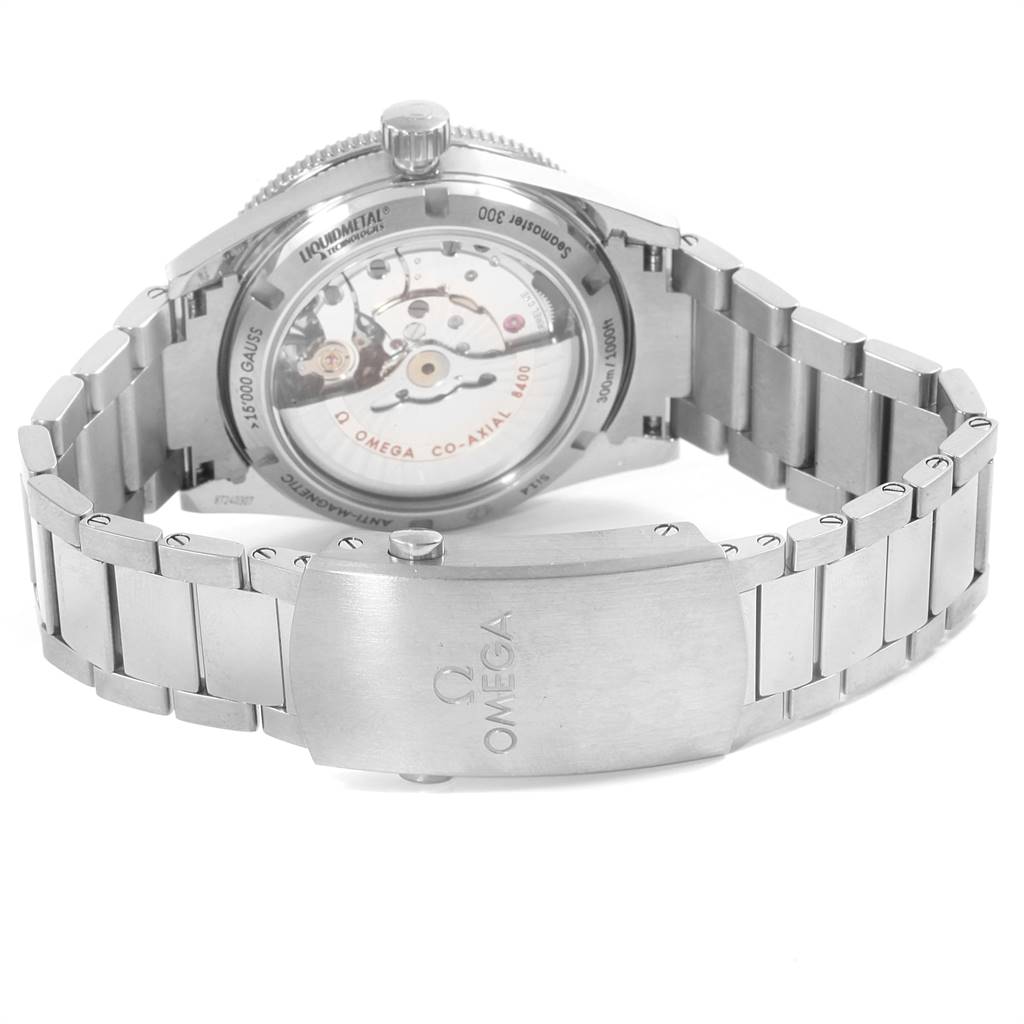 The image shows the back view of an Omega Seamaster 233.90.41.21.03.001 Men
s Titanium Blue Dial 233.90.41.21.03.001 Men
s Titanium Blue Dial watch, highlighting the movement, case back, and stainless steel bracelet with the clasp.