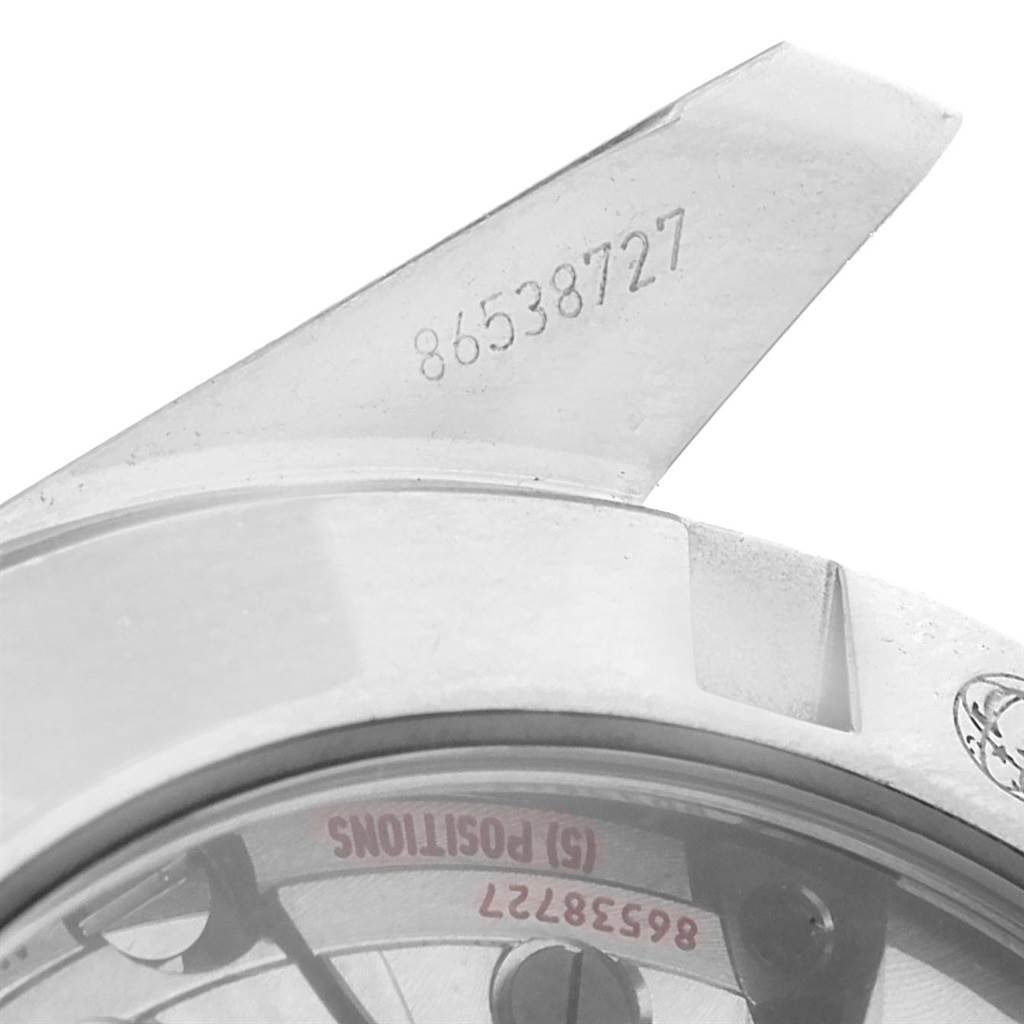 The image shows a close-up angle of an Omega Seamaster 231.10.39.21.03.002 Men's Stainless Steel Blue Dial 231.10.39.21.03.002 Men's Stainless Steel Blue Dial watch, focusing on its serial number engravings and part of the case back.