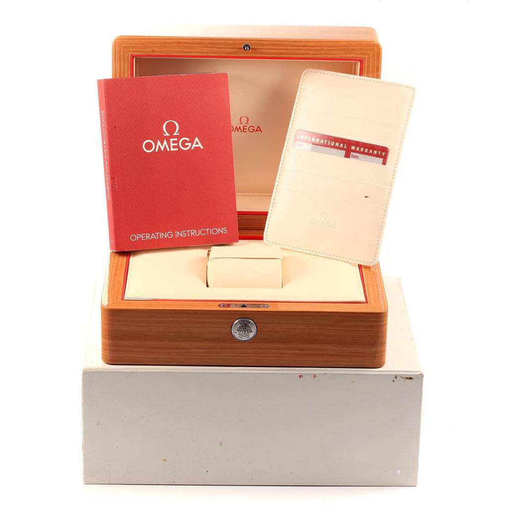 The image shows the Omega Seamaster 231.10.39.21.03.002 Men's Stainless Steel Blue Dial 231.10.39.21.03.002 Men's Stainless Steel Blue Dial watch packaging, including an instruction booklet, a warranty card holder, and a wooden box.