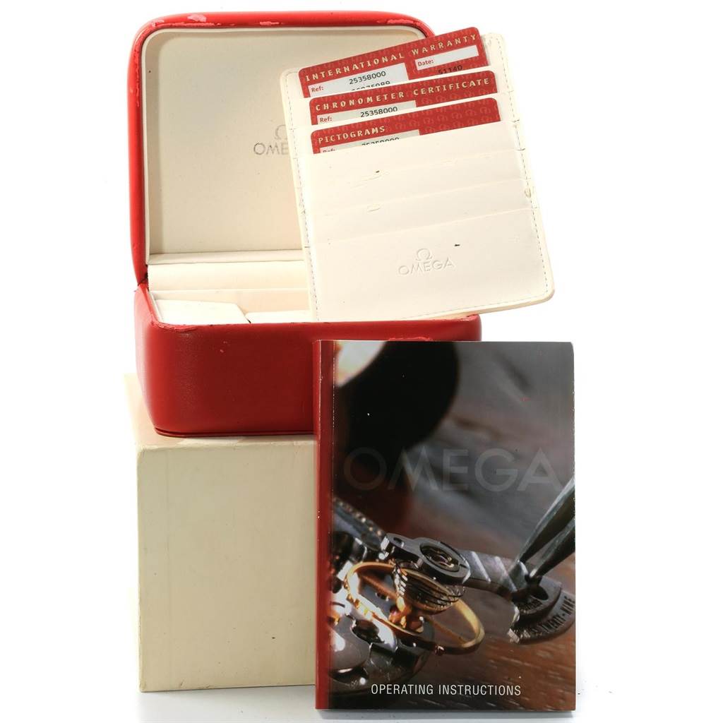 The image shows a red Omega watch box, international warranty cards, and an Omega Seamaster 2535.80.00 Men's Stainless Steel Blue Dial 2535.80.00 Men's Stainless Steel Blue Dial operating instructions booklet.