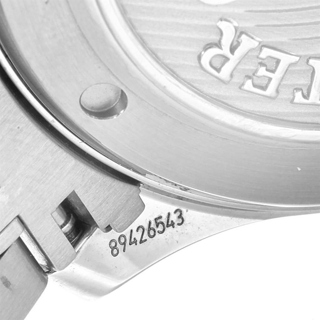 The image shows a close-up of the back case part of an Omega Seamaster 212.30.41.20.01.003 Men
s Stainless Steel Black Dial 212.30.41.20.01.003 Men
s Stainless Steel Black Dial watch with visible serial numbers.