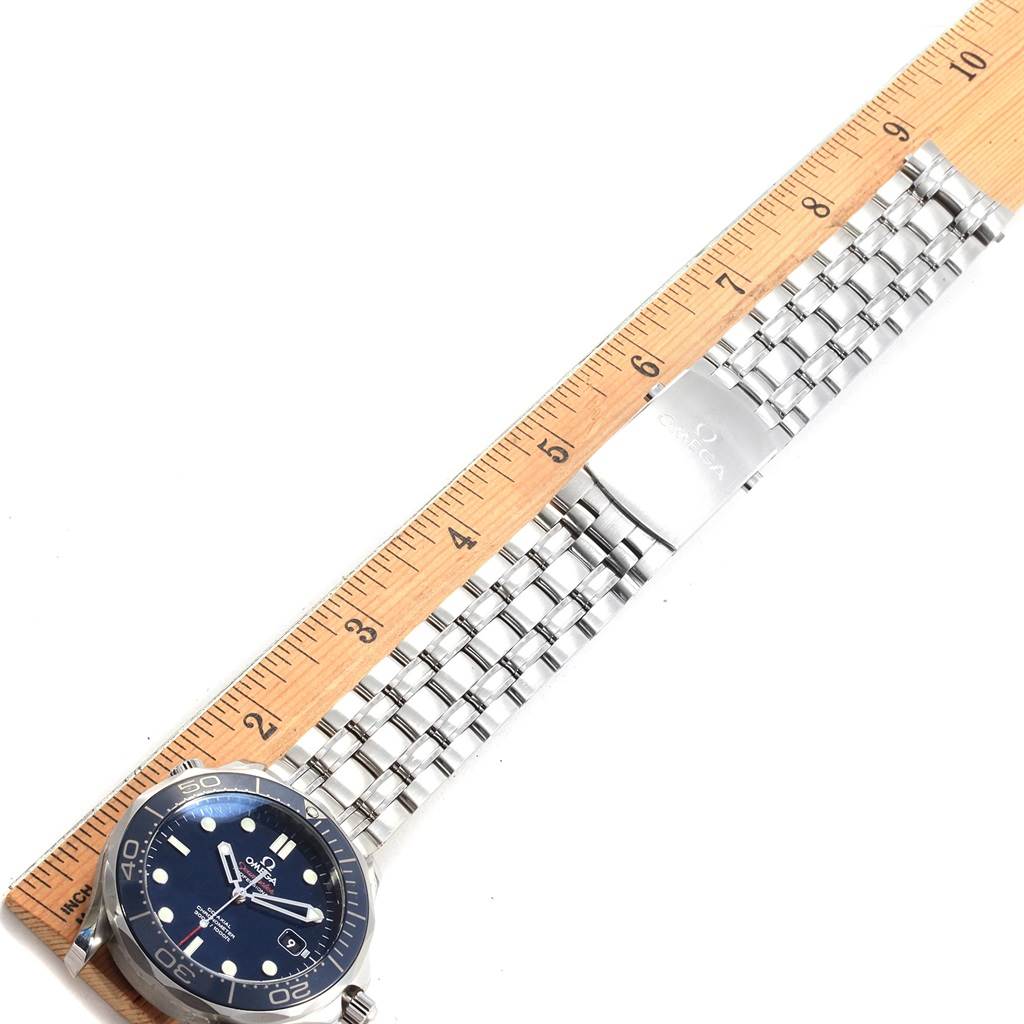 The image shows an Omega Seamaster 212.30.41.20.03.001 Men
s Stainless Steel Blue Dial 212.30.41.20.03.001 Men
s Stainless Steel Blue Dial watch with its face and partially extended metal bracelet alongside a ruler for scale.