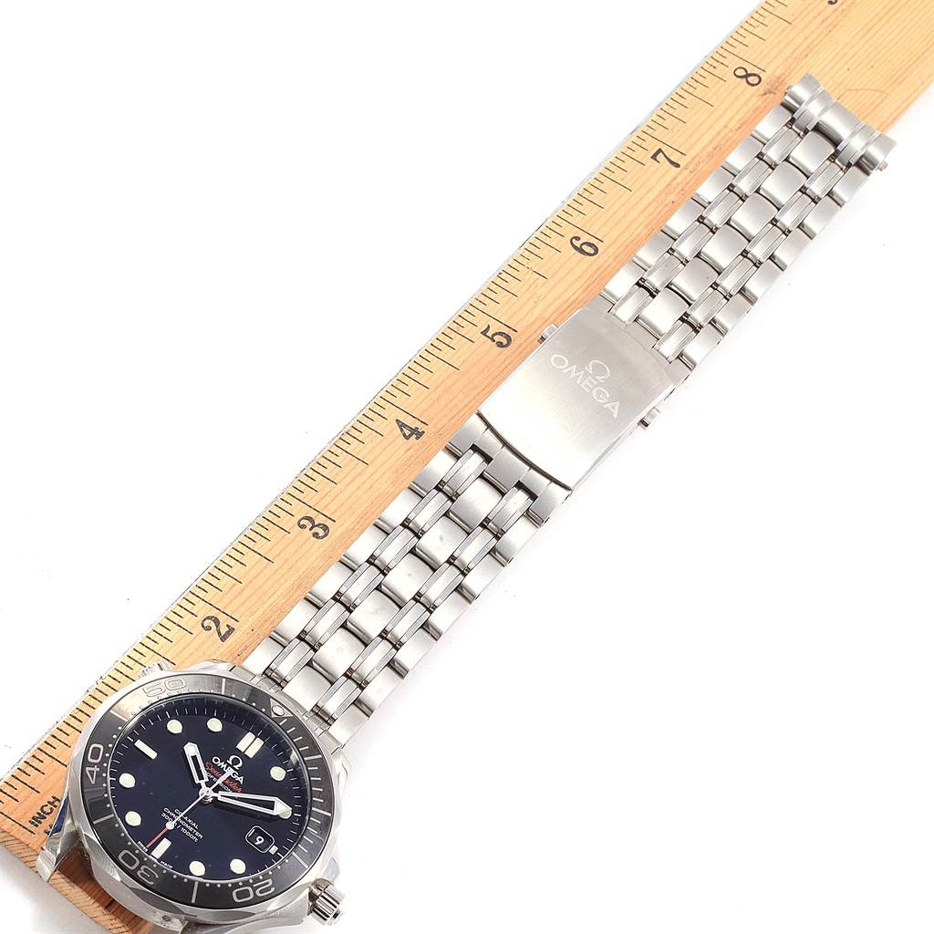 The image shows the Omega Seamaster 212.30.41.20.01.003 Men
s Stainless Steel Black Dial 212.30.41.20.01.003 Men
s Stainless Steel Black Dial watch laid flat, emphasizing its bracelet and measuring it with a ruler.