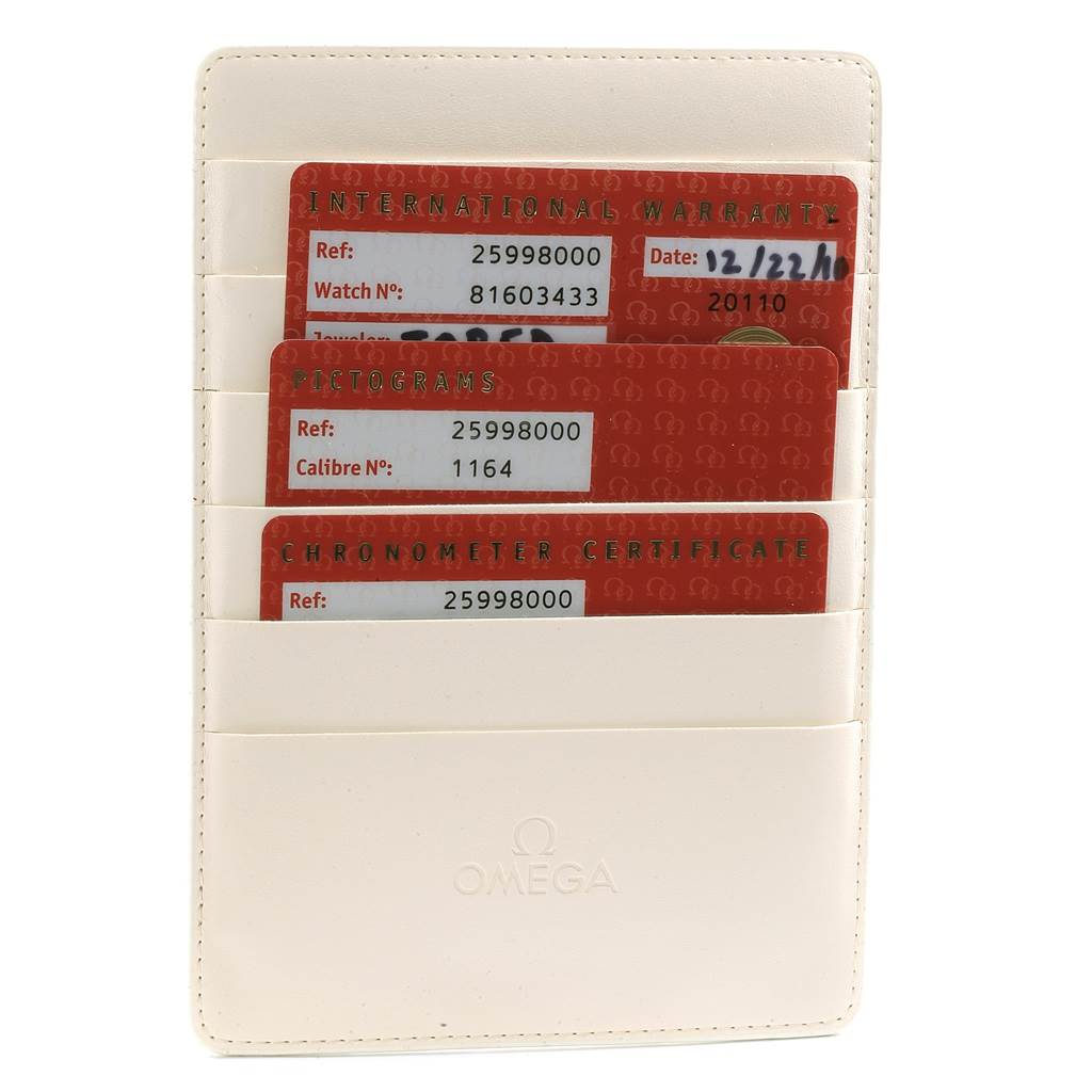 The image shows Omega Seamaster 2599.80.00 Men
s Stainless Steel Blue Dial 2599.80.00 Men
s Stainless Steel Blue Dial
s warranty cards in a white cardholder, displaying the International Warranty, Pictograms, and Chronometer Certificate cards.