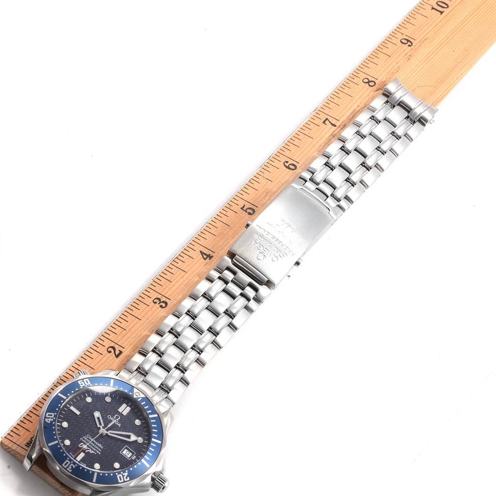This image shows the Omega Seamaster 2537.80.00 Men
s Stainless Steel Blue Dial 2537.80.00 Men
s Stainless Steel Blue Dial watch lying flat, displaying the face and metal bracelet along with a ruler for scale.