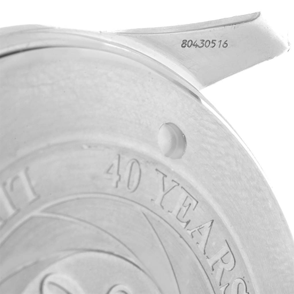 This image shows a close-up of the back of an Omega Seamaster 2537.80.00 Men
s Stainless Steel Blue Dial 2537.80.00 Men
s Stainless Steel Blue Dial watch, revealing part of an inscription and serial number.