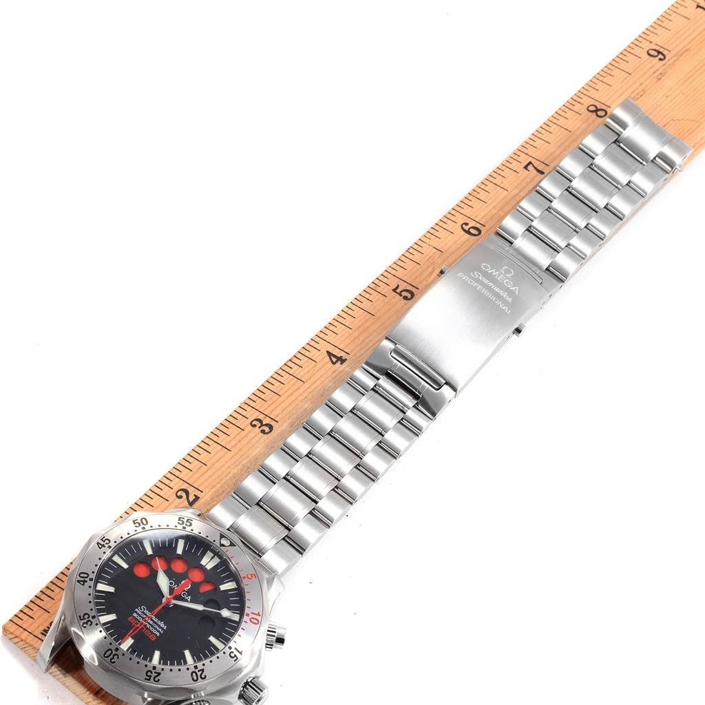 This image shows an Omega Seamaster 2595.50.00 Men
s Stainless Steel Black Dial 2595.50.00 Men
s Stainless Steel Black Dial watch laid flat next to a ruler, displaying its bracelet and dial from a top-down angle.