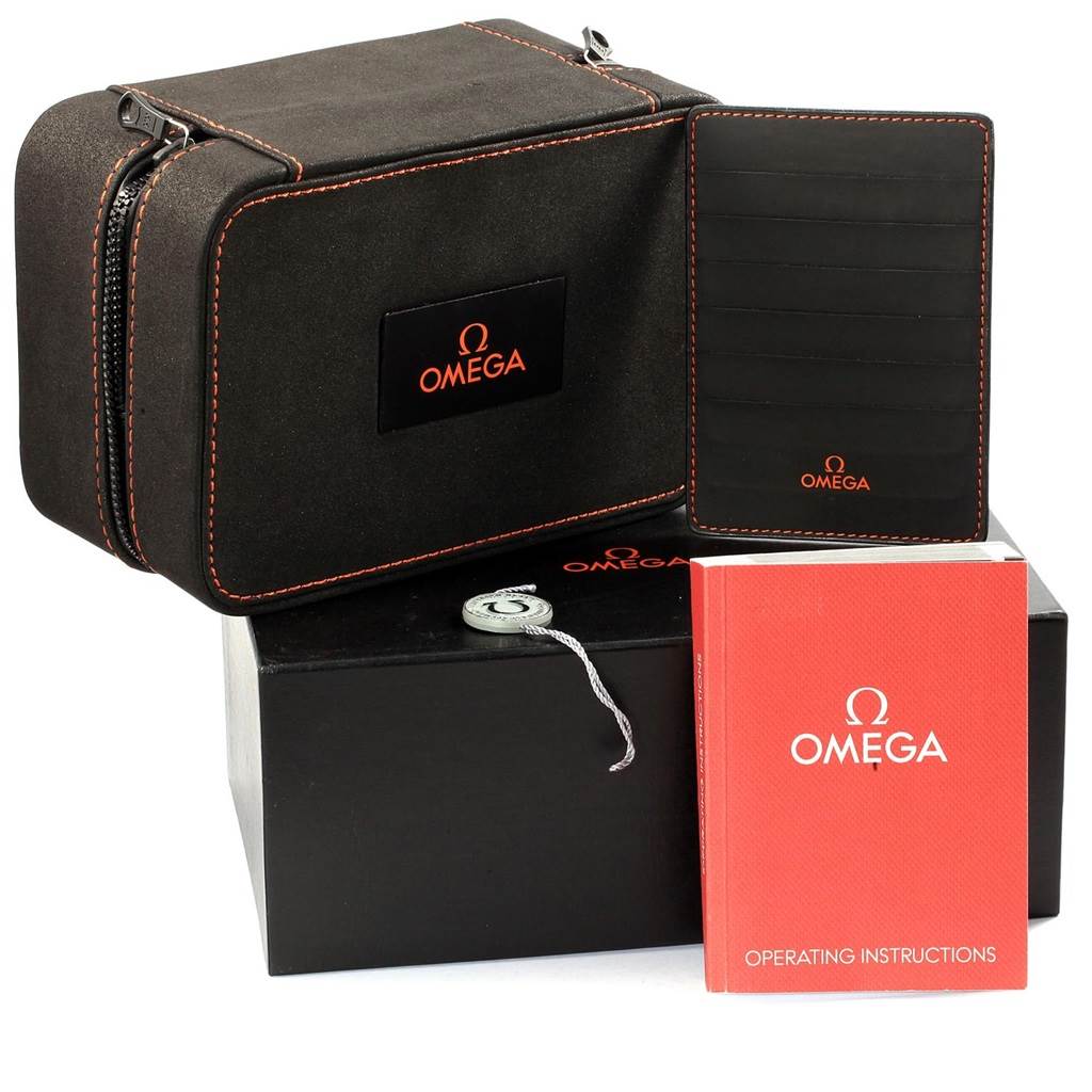 The image shows the packaging, operating instructions, and accessories for the Omega Ploprof 224.30.55.21.01.001 Men's Stainless Steel Black Dial 224.30.55.21.01.001 Men's Stainless Steel Black Dial model watch.