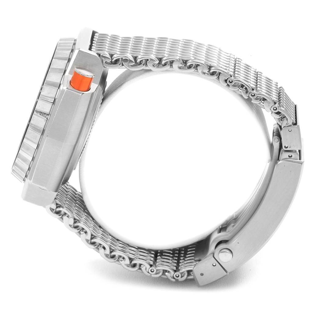 The Omega Ploprof 224.30.55.21.01.001 Men's Stainless Steel Black Dial 224.30.55.21.01.001 Men's Stainless Steel Black Dial watch is shown from a side view, highlighting its stainless steel case, bracelet, and an orange button.