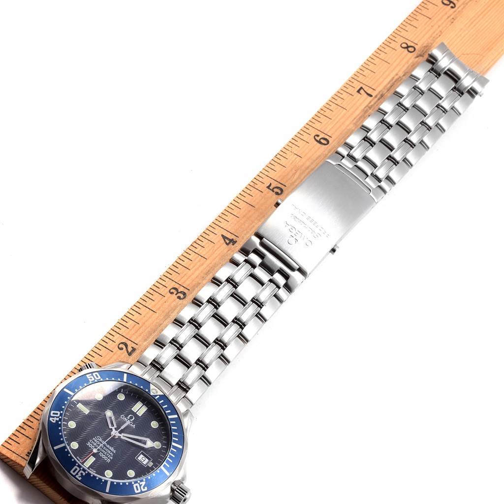 The image shows a top view of the Omega Seamaster 2531.80.00 Men
s Stainless Steel Blue Dial 2531.80.00 Men
s Stainless Steel Blue Dial watch, focusing on its blue dial, bezel, and metal bracelet alongside a ruler.