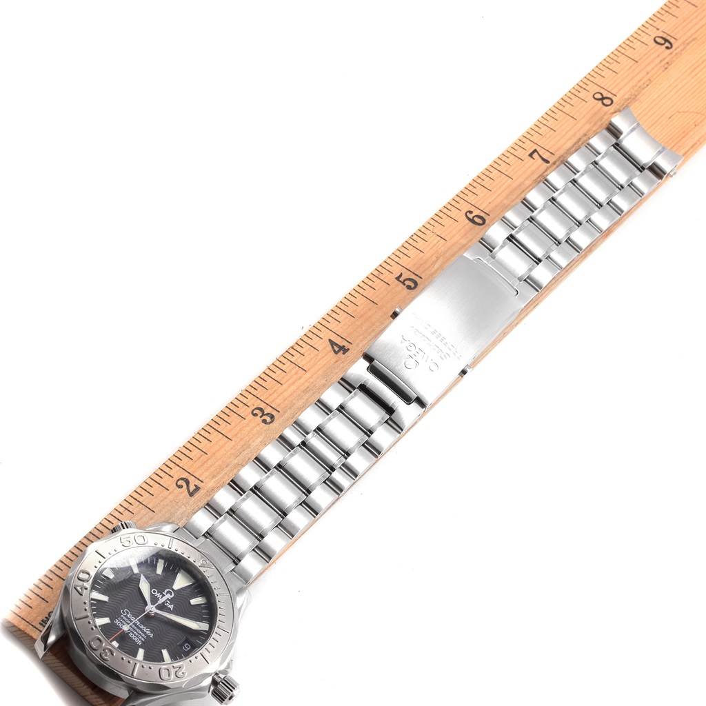 The image shows an Omega Seamaster 2236.50.00 Women's Stainless Steel Black Dial 2236.50.00 Women's Stainless Steel Black Dial watch laid flat next to a ruler, displaying the face and stainless steel bracelet.