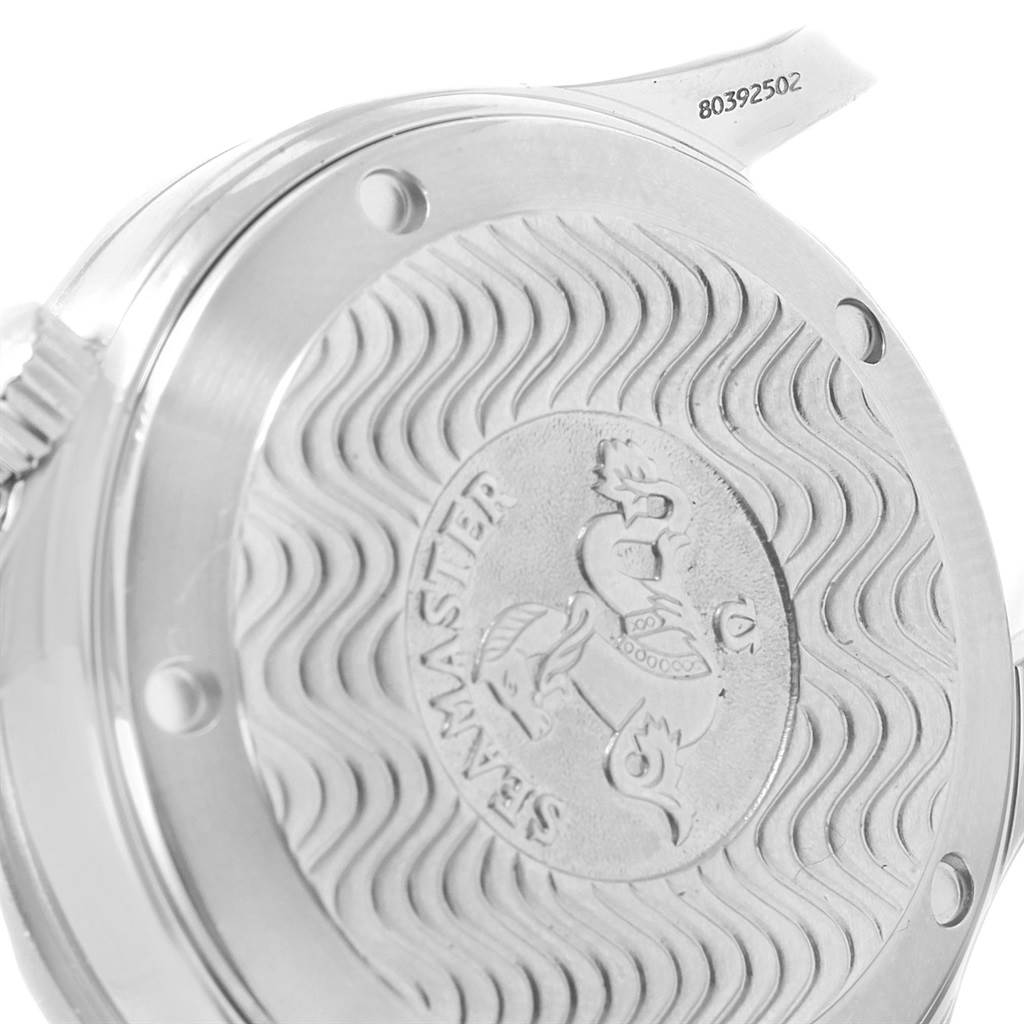 This image shows the back casing of an Omega Seamaster 2236.50.00 Women's Stainless Steel Black Dial 2236.50.00 Women's Stainless Steel Black Dial watch, featuring the iconic wavy pattern and engraved logo.
