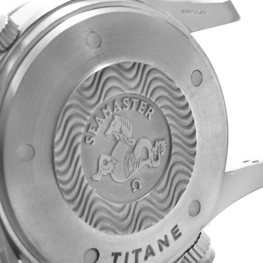 The image shows the case back of an Omega Seamaster 2298.80.00 Men
s Titanium Blue Dial 2298.80.00 Men
s Titanium Blue Dial watch with the Seamaster logo and wave pattern in focus.