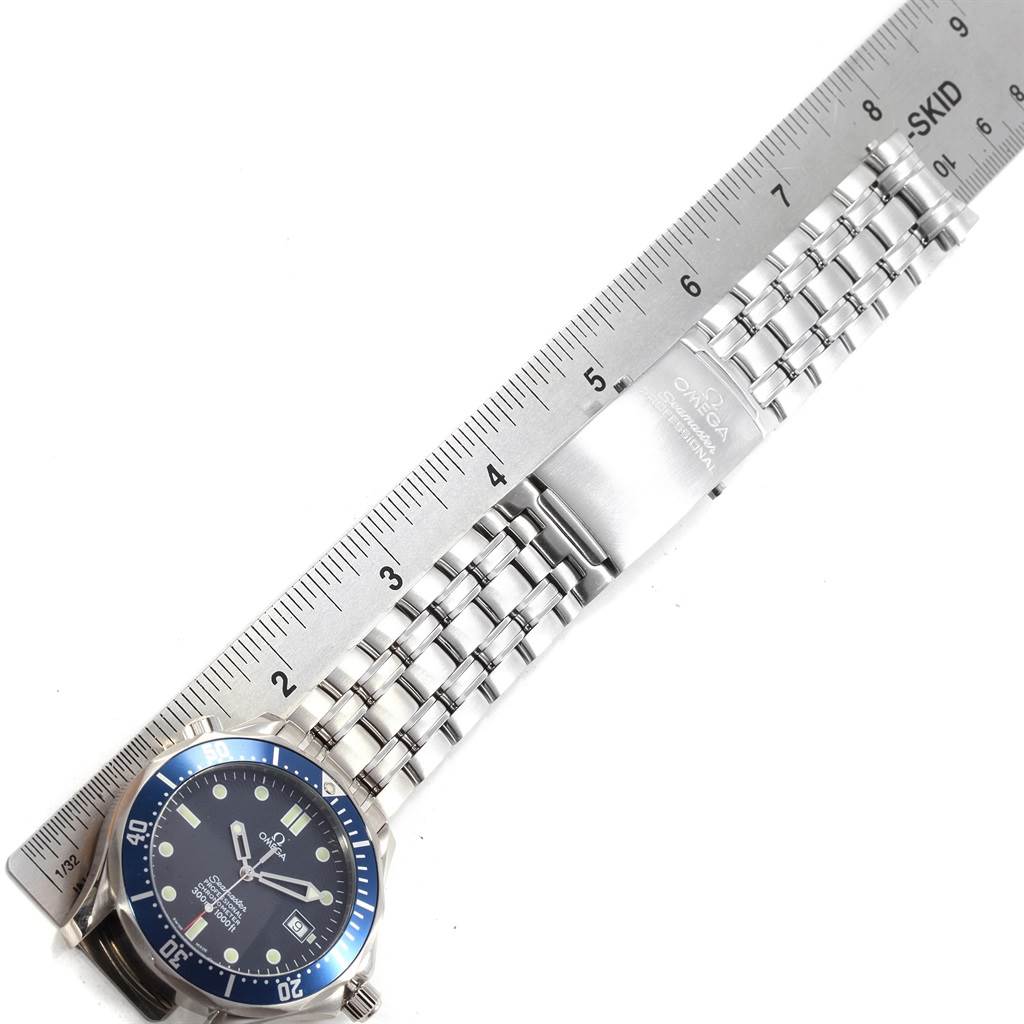 The image shows an Omega Seamaster 2252.50.00 Men's Stainless Steel Black Dial 2252.50.00 Men's Stainless Steel Black Dial watch laid flat, with the clasp, bracelet, and part of the bezel visible, alongside a ruler for scale.