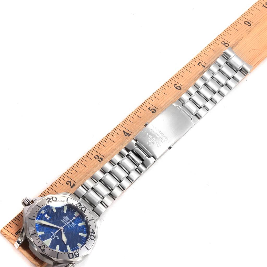 The image shows an Omega Seamaster 2255.80.00 Men
s Stainless Steel Blue Dial 2255.80.00 Men
s Stainless Steel Blue Dial watch laid flat with a ruler for scale, highlighting its face and metal bracelet.
