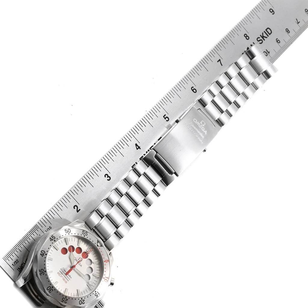 The image shows the Omega Seamaster 2595.30.00 Men
s Stainless Steel Silver Dial 2595.30.00 Men
s Stainless Steel Silver Dial model watch laid flat with a ruler, featuring its dial, bracelet, and clasp.