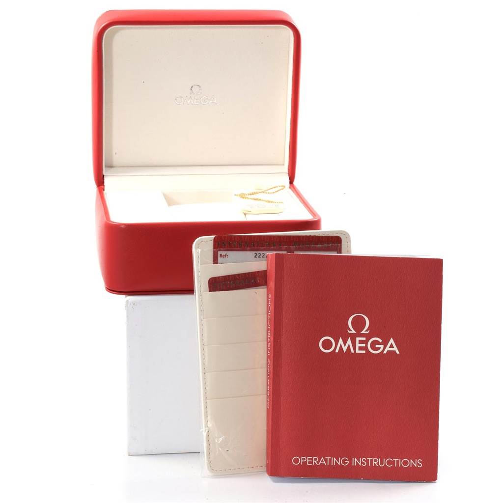 The image shows an Omega Seamaster 2222.80.00 Men
s Stainless Steel Blue Dial 2222.80.00 Men
s Stainless Steel Blue Dial watch box, a red operating instructions booklet, and warranty cards at a frontal angle.