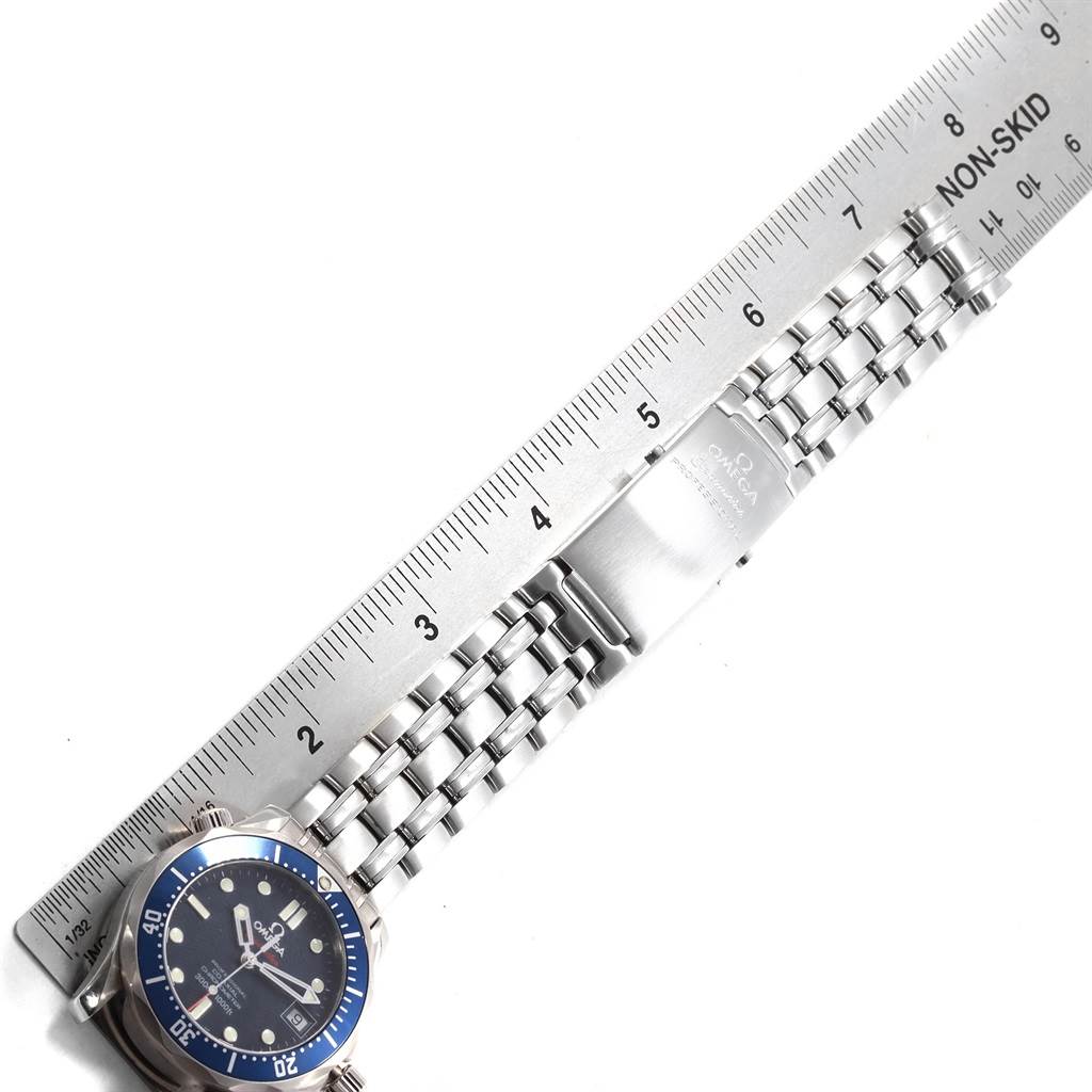 The image displays the Omega Seamaster 2222.80.00 Men
s Stainless Steel Blue Dial 2222.80.00 Men
s Stainless Steel Blue Dial watch laid flat with its face, bezel, and bracelet shown, next to a ruler for scale.