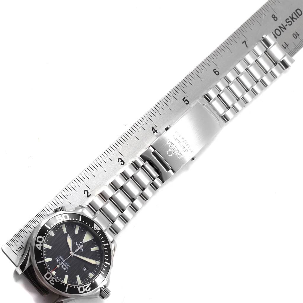 The image shows an Omega Seamaster 2264.50.00 Men
s Stainless Steel Black Dial 2264.50.00 Men
s Stainless Steel Black Dial watch laid flat, with a ruler measuring its stainless steel bracelet and clasp.