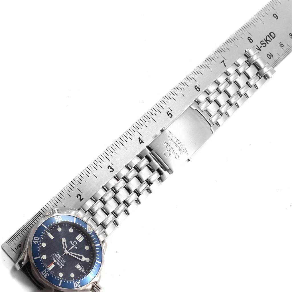 The image shows an Omega Seamaster 2531.80.00 Men
s Stainless Steel Blue Dial 2531.80.00 Men
s Stainless Steel Blue Dial watch with a stainless steel band and a ruler for size reference.