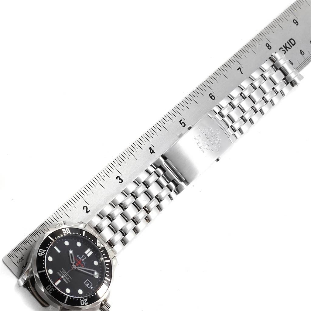 The image shows an Omega Seamaster 212.30.41.20.01.001 Men
s Stainless Steel Black Dial 212.30.41.20.01.001 Men
s Stainless Steel Black Dial watch with a metal bracelet, measured against a ruler, focusing on the face and partial bracelet of the watch.