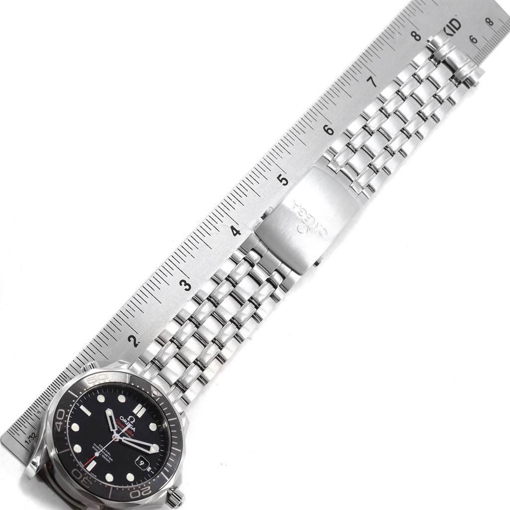 The image shows an Omega Seamaster 212.30.41.20.01.003 Men
s Stainless Steel Black Dial 212.30.41.20.01.003 Men
s Stainless Steel Black Dial watch viewed from above, displaying the watch face, bracelet, and clasp parallel to a ruler.