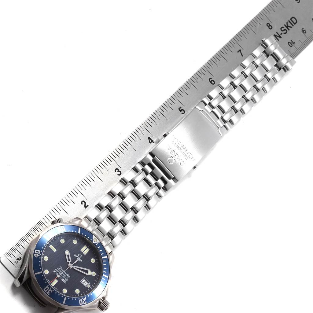 The image shows an Omega Seamaster 2531.80.00 Men
s Stainless Steel Blue Dial 2531.80.00 Men
s Stainless Steel Blue Dial watch laid flat with a ruler measuring its stainless steel bracelet.