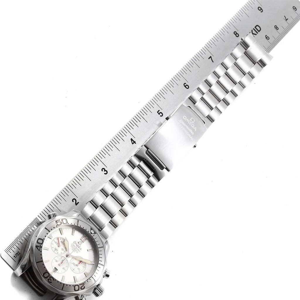 The Omega Seamaster 2589.30.00 Men
s Stainless Steel Silver Dial 2589.30.00 Men
s Stainless Steel Silver Dial watch is shown from an overhead angle, highlighting its face, bezel, bracelet, and clasp, with a ruler for scale.