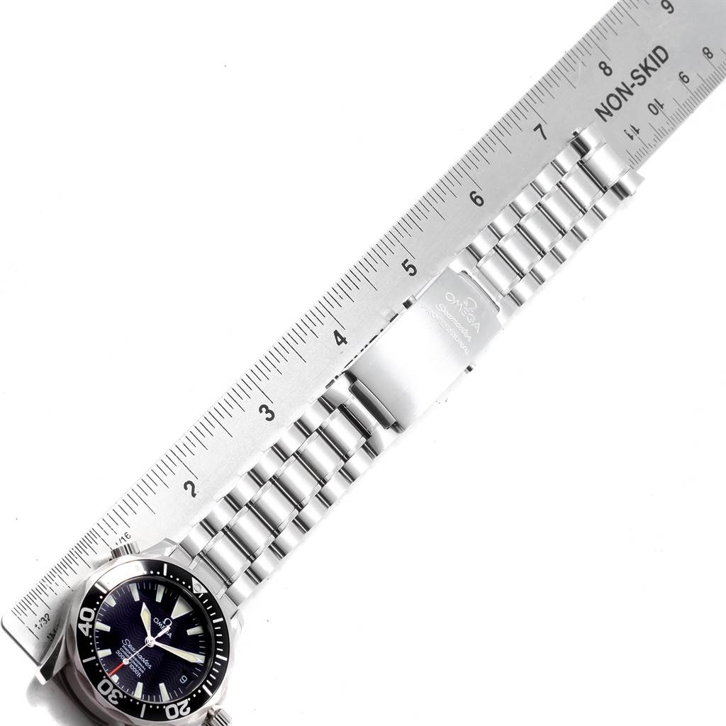 The image shows an Omega Seamaster 2252.50.00 Men
s Stainless Steel Black Dial 2252.50.00 Men
s Stainless Steel Black Dial watch laid flat with a stainless steel bracelet and clasp, aligned with a ruler.