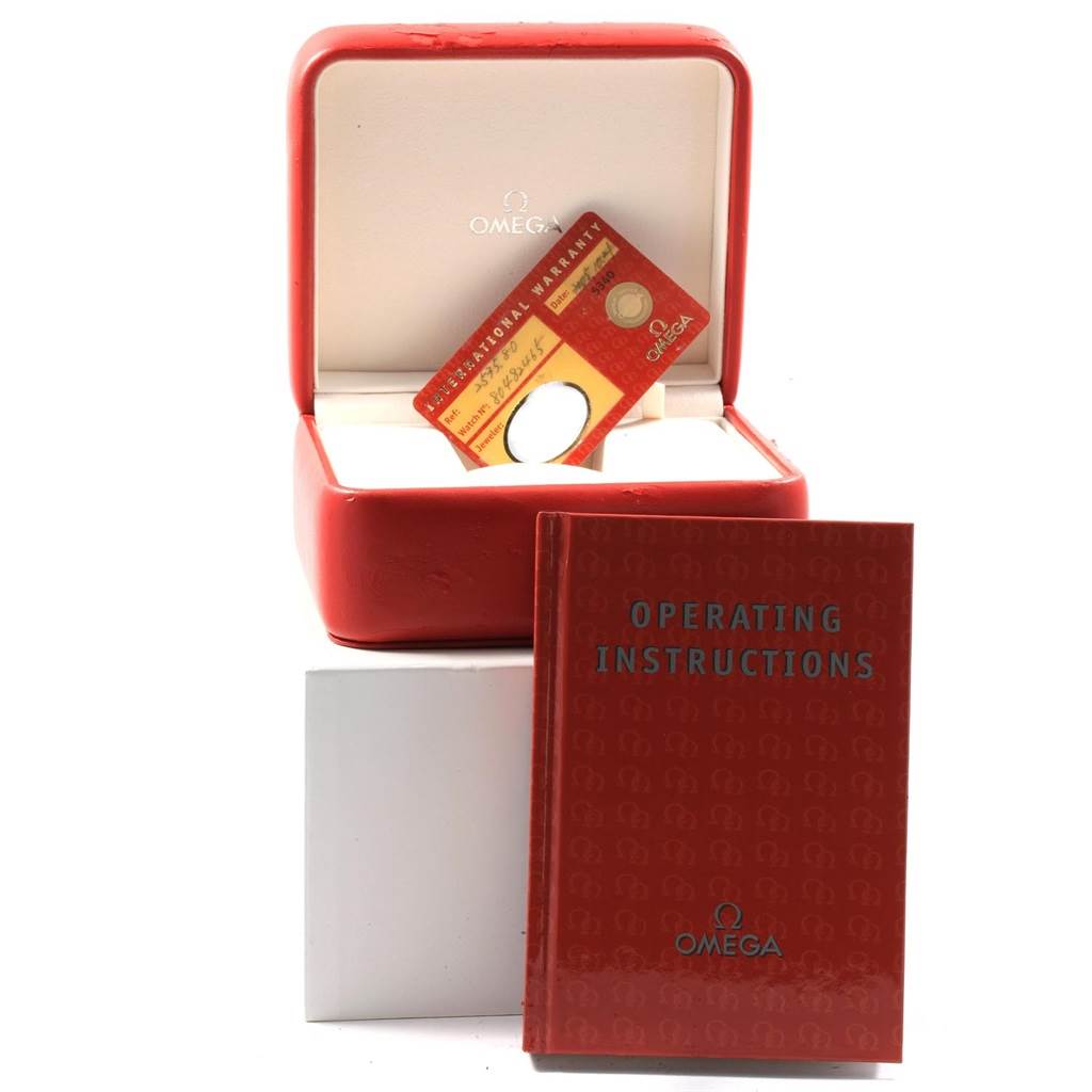 The image shows the Omega Seamaster 2535.80.00 Men
s Stainless Steel Blue Dial 2535.80.00 Men
s Stainless Steel Blue Dial
s red watch box, warranty card, and operating instructions book.