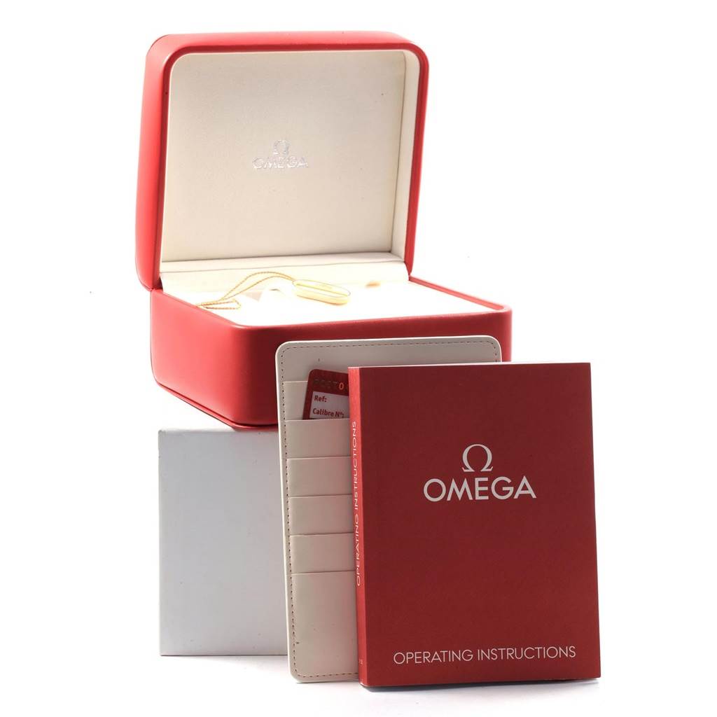 The image shows an Omega Seamaster 2222.80.00 Men
s Stainless Steel Blue Dial 2222.80.00 Men
s Stainless Steel Blue Dial watch box, an operating instructions manual, and a cardholder with cards.