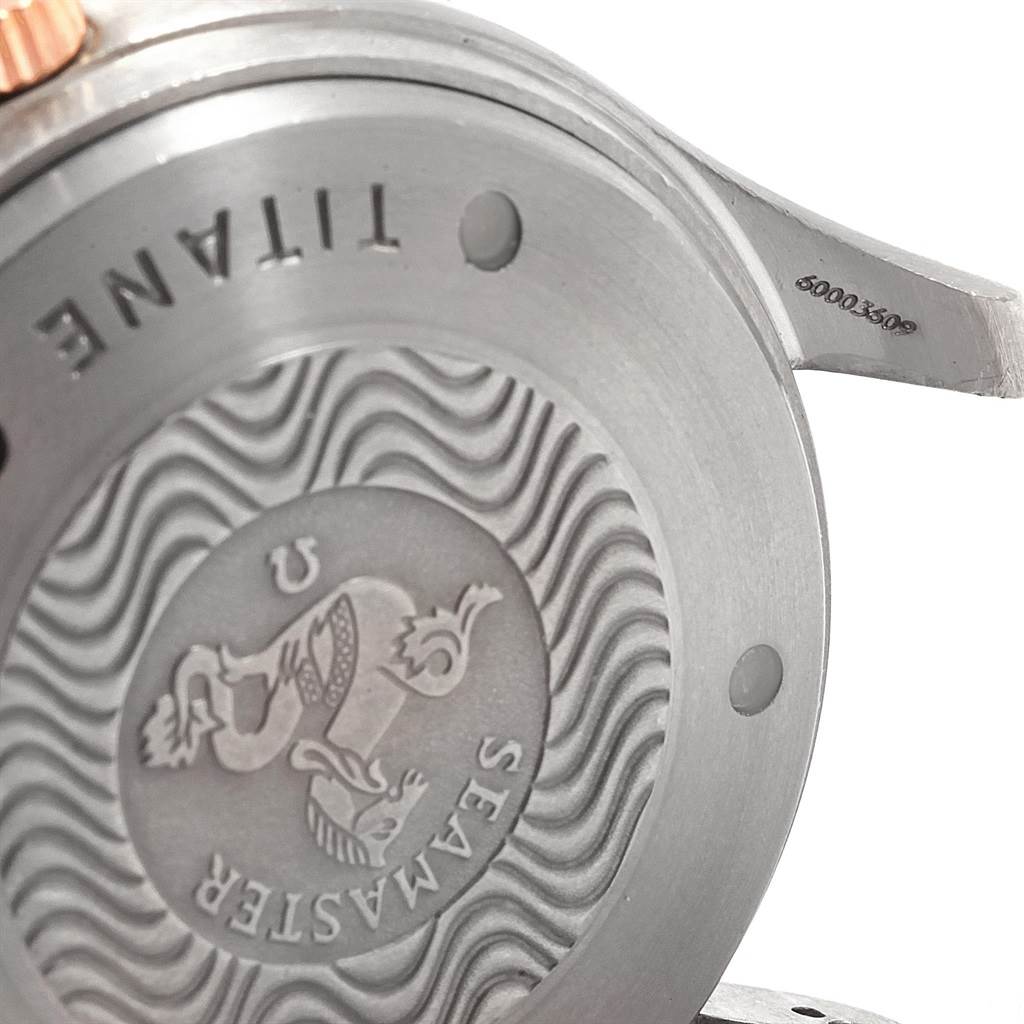 This image shows the case back of an Omega Seamaster 2296.80.00 Men
s Titanium Blue Dial 2296.80.00 Men
s Titanium Blue Dial watch, highlighting its engraved design and titanium material.