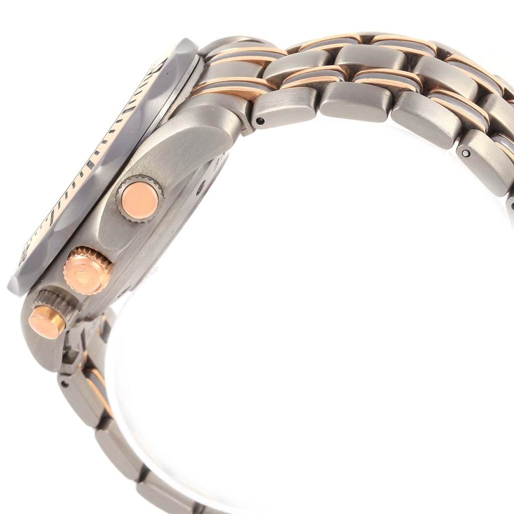 The image shows a side view of an Omega Seamaster 2296.80.00 Men
s Titanium Blue Dial 2296.80.00 Men
s Titanium Blue Dial watch, highlighting the crown, pushers, and part of the metal bracelet.