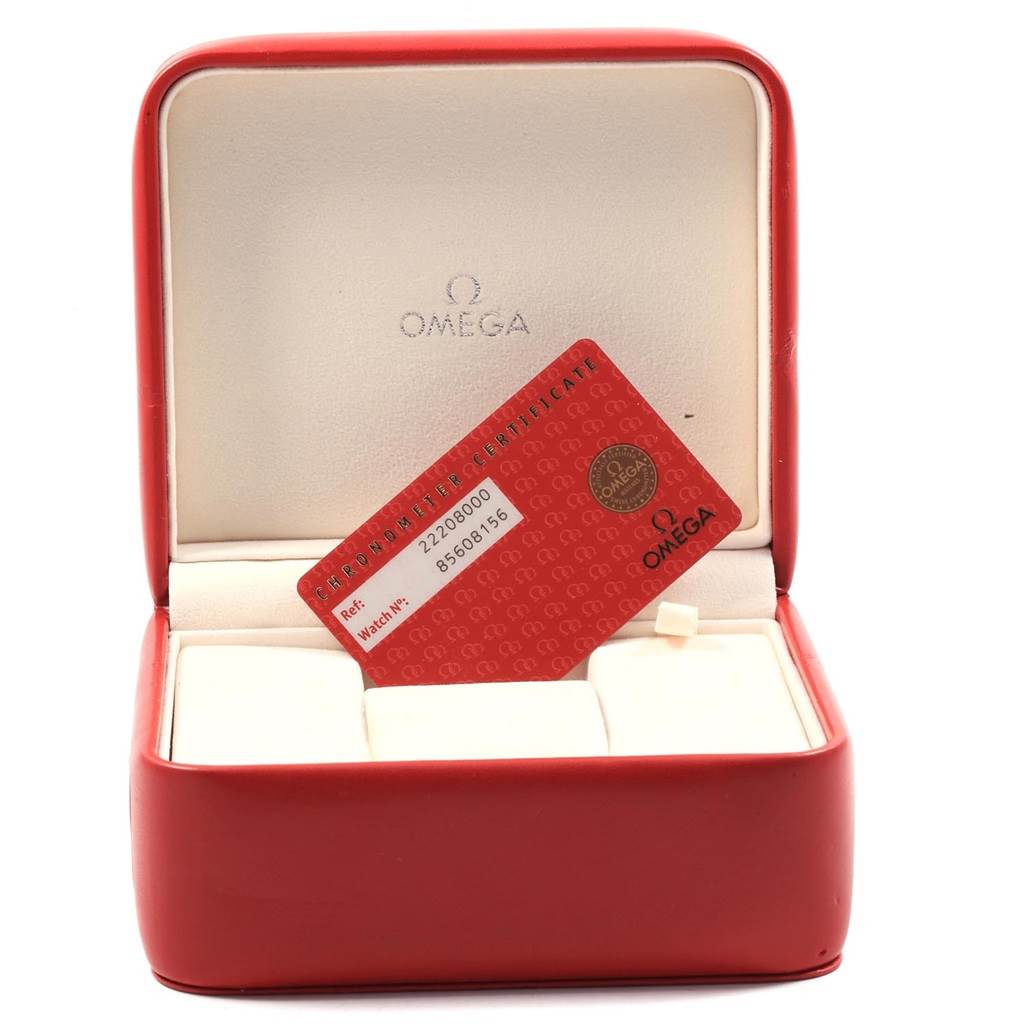 A red Omega watch box is shown with a chronometer certificate card for a Seamaster model.