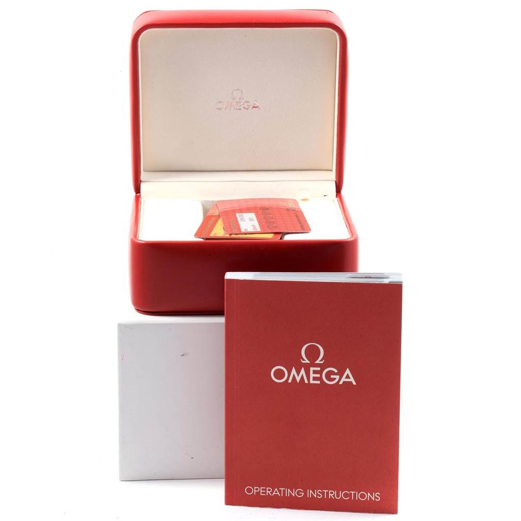 The image shows the open box and operating instructions for an Omega Seamaster 2595.30.00 Men
s Stainless Steel Silver Dial 2595.30.00 Men
s Stainless Steel Silver Dial watch.