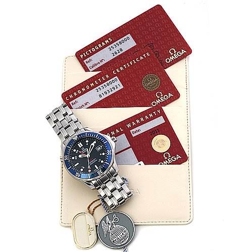 The image shows the Omega Seamaster 25358000 OR 2535.   80.   00 Men's Stainless Steel Blue Dial 25358000 OR 2535.   80.   00 Men's Stainless Steel Blue Dial watch at an angle that highlights its face and strap, alongside certification and warranty cards.