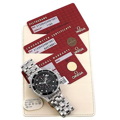 The image shows an Omega Seamaster 21330424001001 Men's Stainless Steel Black Dial 21330424001001 Men's Stainless Steel Black Dial watch at a slight angle, resting on cards for pictograms, chronometer certificate, and international warranty.