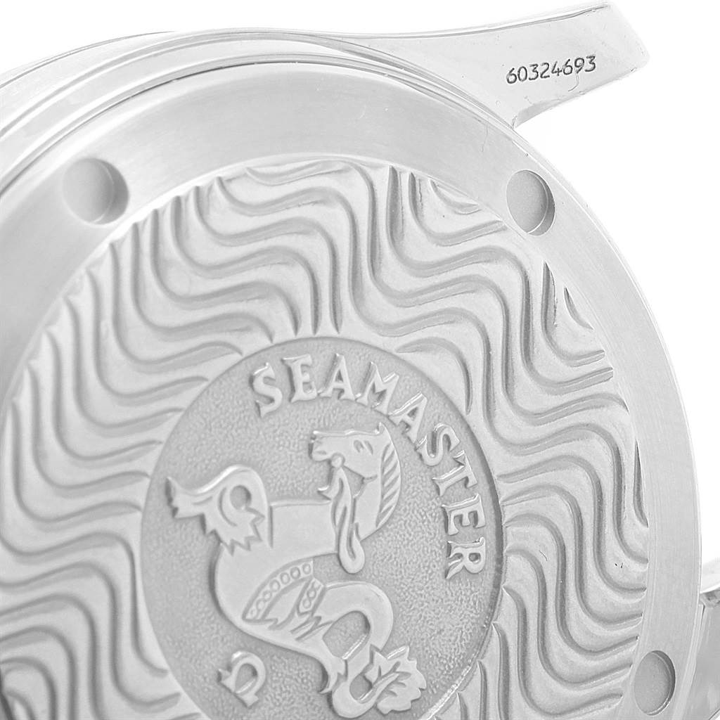 The image shows the case back of an Omega Seamaster 2551.80.00 Men
s Stainless Steel Blue Dial 2551.80.00 Men
s Stainless Steel Blue Dial watch with its distinctive wavy pattern and engraved seahorse logo.
