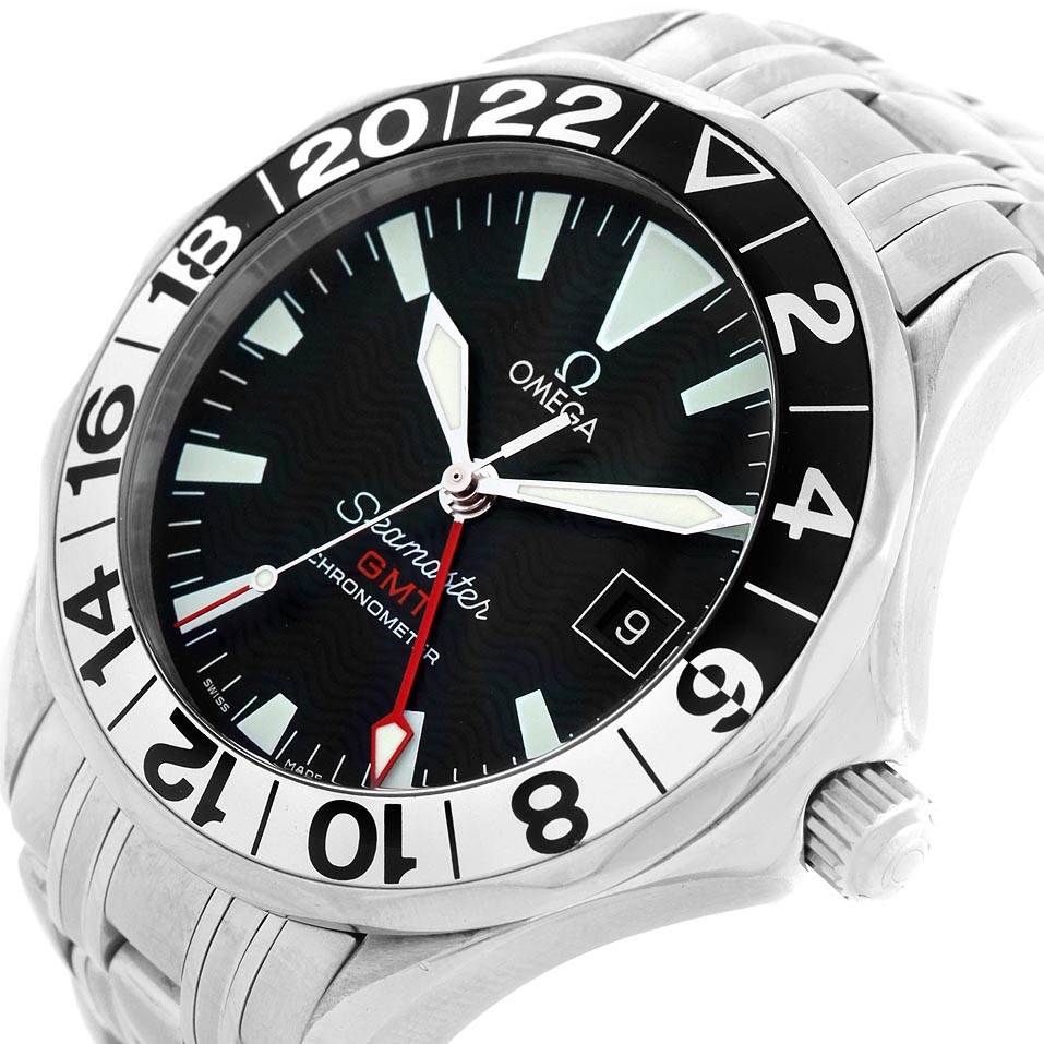 The image shows a close-up of the Omega Seamaster 2234.50.00 Men
s Stainless Steel Black Dial 2234.50.00 Men
s Stainless Steel Black Dial watch face and part of the stainless steel bracelet band.