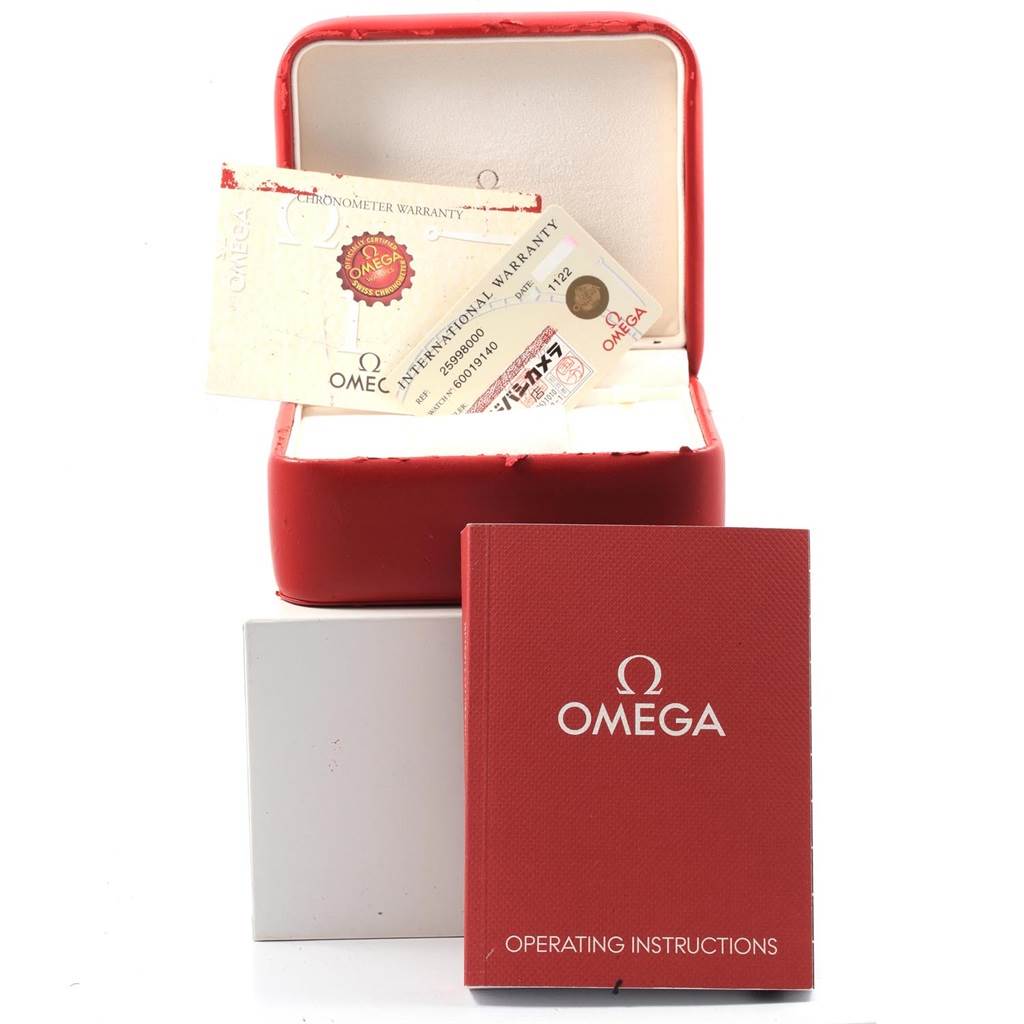 The image shows an Omega Seamaster 2599.80.00 Men
s Stainless Steel Blue Dial 2599.80.00 Men
s Stainless Steel Blue Dial watch box, warranty cards, and operating instructions from a front angle.