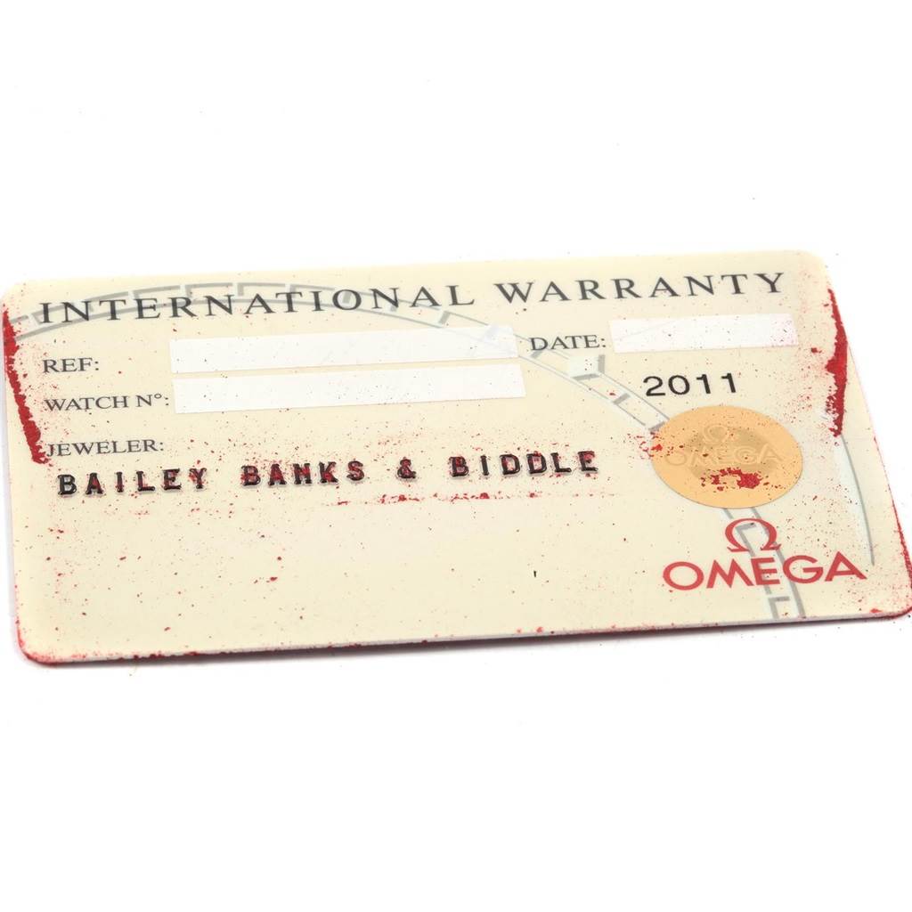 The image shows an Omega Seamaster 2311.21.00 Men's Steel and Gold (two tone) White Dial 2311.21.00 Men's Steel and Gold (two tone) White Dial International Warranty card with jeweler details partly visible.