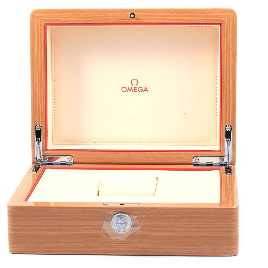 The image shows an open wooden Omega box meant for a Seamaster watch, including the logo inside the lid and a cushioned watch holder.