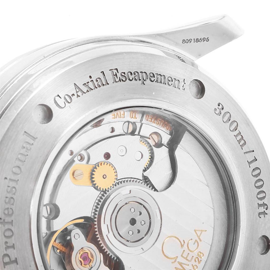 The image shows the back view of an Omega Seamaster 2535.80.00 Men
s Stainless Steel Blue Dial 2535.80.00 Men
s Stainless Steel Blue Dial watch case, highlighting the Co-Axial escapement mechanism.