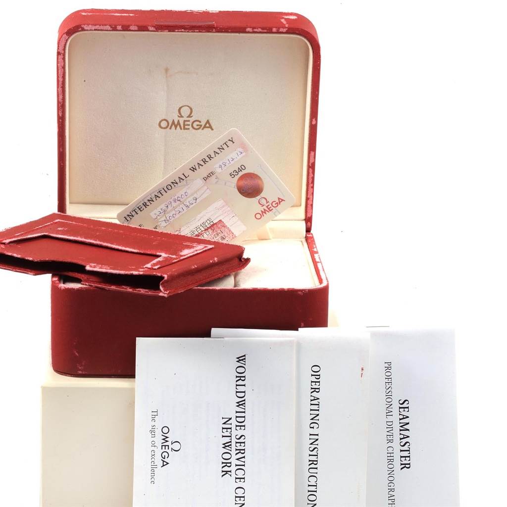 An Omega Seamaster 2599.80.00 Men
s Stainless Steel Blue Dial 2599.80.00 Men
s Stainless Steel Blue Dial watch box with warranty card, leather holder, and instruction manuals are shown from a front angle.