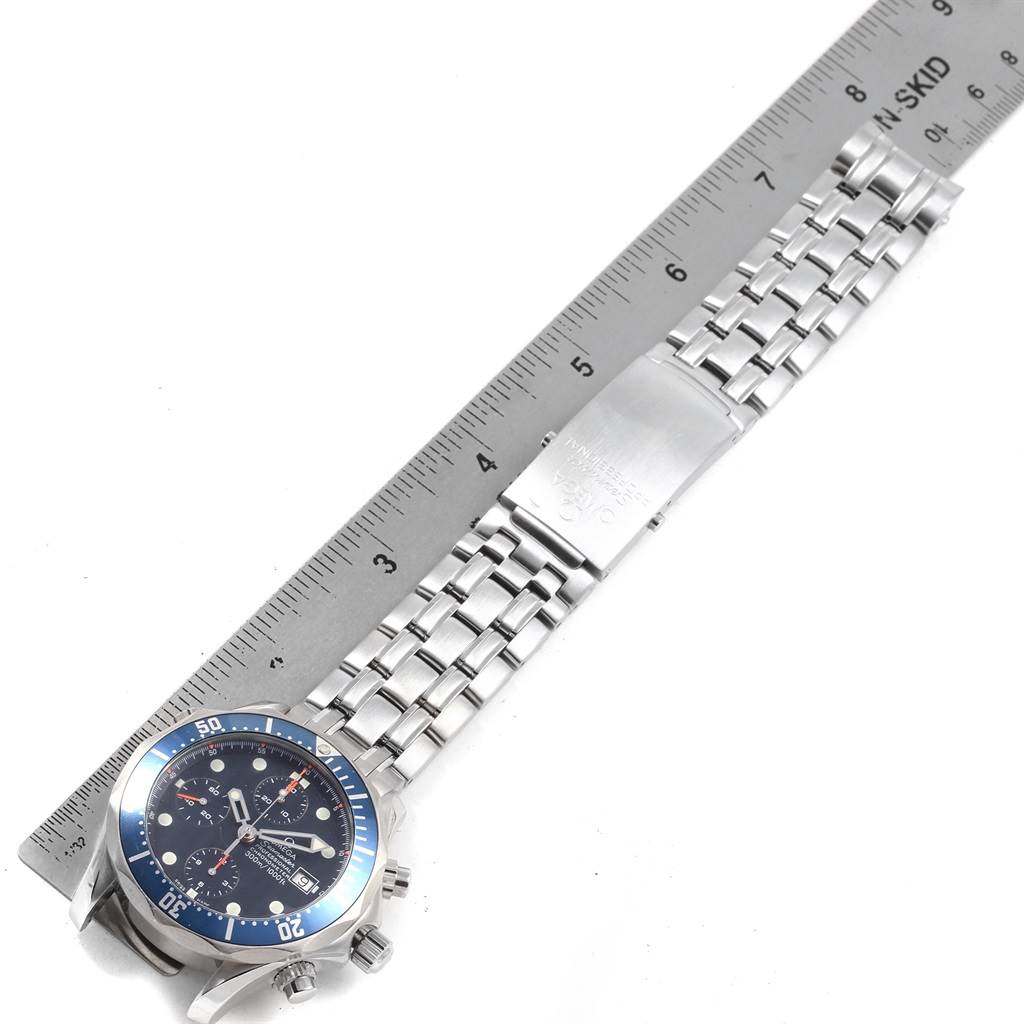 The Omega Seamaster 2599.80.00 Men
s Stainless Steel Blue Dial 2599.80.00 Men
s Stainless Steel Blue Dial watch is shown from a top-down angle with the face, bezel, bracelet, and clasp visible, alongside a ruler for scale.