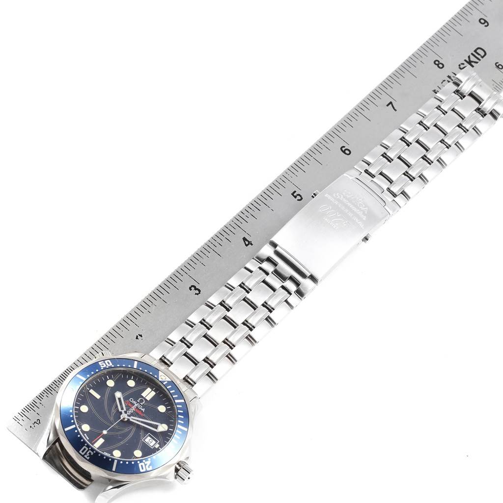 The Omega Seamaster 2226.80.00 Men's Stainless Steel Blue Dial 2226.80.00 Men's Stainless Steel Blue Dial watch is shown from a top-down angle, displaying the face, bracelet, and clasp alongside a ruler for scale.