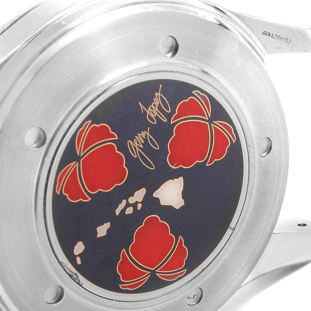 This image displays the case back of an Omega Seamaster 2536.50.00 Men's Stainless Steel Black Dial 2536.50.00 Men's Stainless Steel Black Dial watch, featuring a decorative design with red elements and engravings.