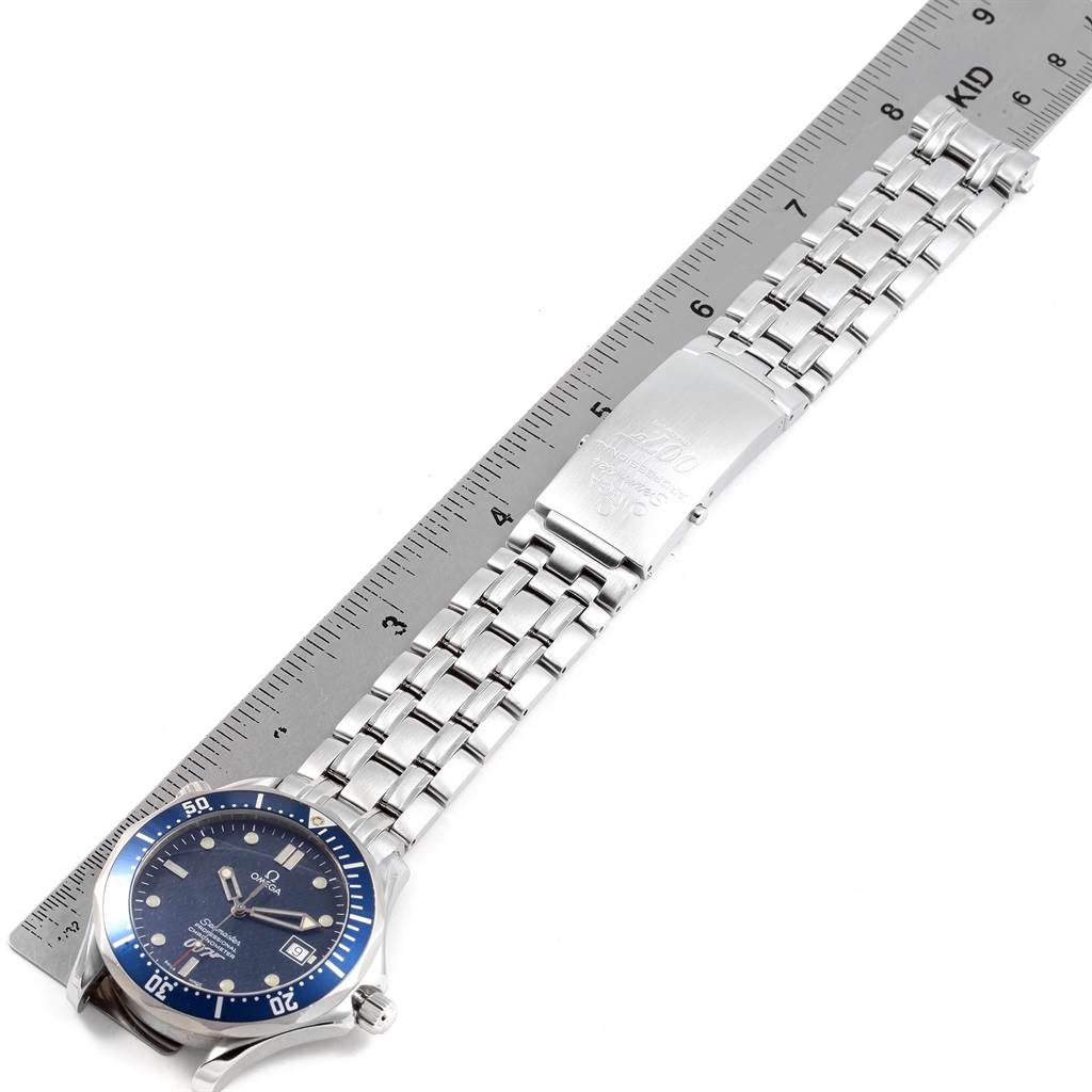 The Omega Seamaster 2537.80.00 Men
s Stainless Steel Blue Dial 2537.80.00 Men
s Stainless Steel Blue Dial watch is shown from the top-down angle, including the dial, bezel, and metallic bracelet with a ruler for scale.